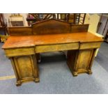 An impressive Victorian pedestal sideboard. Designed with various exterior and interior drawers.