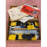 A Wooden box containing a collection of meccano and manuals