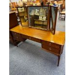 A Stag dressing table designed with a three wat mirror and stool