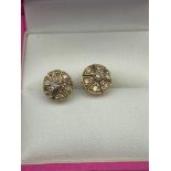 A Pair of 9ct gold and diamond earrings. [1.50grams]