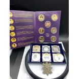 A Selection of mint coins to include small 14ct gold Princess Diana coin and military cap badge.