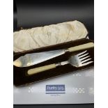 A Walker & Hall Sheffield silver collar serving fork and knife. Complete with a fitted box.