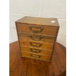 Antique oak miniature hobby chest produced by Henry Stone & Son, Manufacturers Banbury. Containing