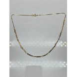 A 9ct gold ladies twist necklace. [38cm in length] [3.05grams]