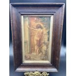 An Antique watercolour painting of a nude figure standing in a door way. Fitted in a gilt and dark
