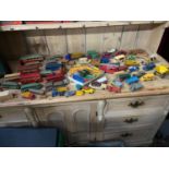 A Large collection of play worn Dinky Models and two Dinky Toys price guides. Includes Dinky Ferrari