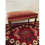 A 19th century dressing table stool, designed with turned leg supports [Standing 44cm tall, 62cm