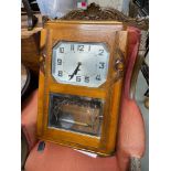 A French Art Deco wall clock. Comes with key and pendulum. 55X38X16CM