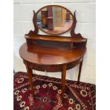 A 19th century half moon dressing table, designed with an oval mirror back. [H:128cm X L:96cm X W: