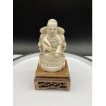A Chinese Ming Dynasty ivory carving of an emperor sat on a throne. Beautifully carved showing