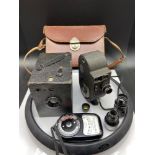 A Vintage Bell & Howell Filmo Double Run Eight Model 134-a cine camera with various lenses, case and