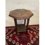 A 19th century Jacobean style hand carved two tier side table.[ Standing 73cm high and 53cm in