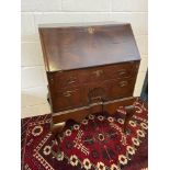 An 18th/ 19th century writing bureau. Designed with a shell carved front secret drawer. Supported