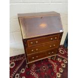 A Nice example of a 19th century writing bureau. Designed with a shell inlay design to the lid