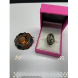 An Edinburgh silver and agate ring, together with a white metal, agate and citrine Scottish Brooch.