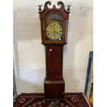 A 19th century mahogany long cased grandfather clock. Designed with a hand painted clock face.