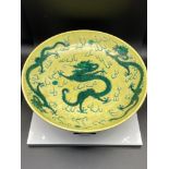 A Chinese Famille Jaune Green Decorated 'Dragon' Charger. [34.5cm in diameter]