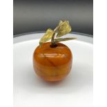 An Antique Butterscotch Amber and bronze/ brass apple sculpture. Signed to the underside of the