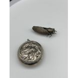 A White metal Chinese dragon design snuff pendant, together with a white metal locus bug brooch.