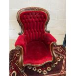 A Victorian Red button back library/ Fire side arm chair. Standing 112cm high.