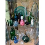 Two shelves of various art glass and antique glass to include Georgian green glass wine bottle [As