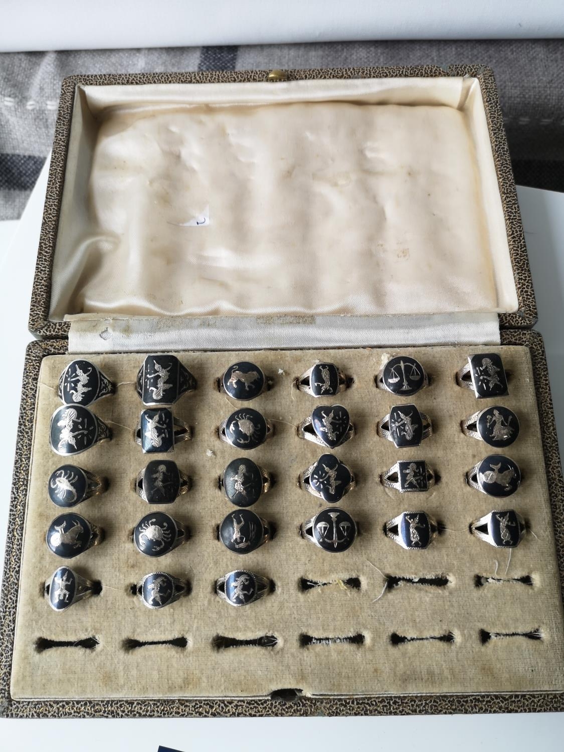 A Vintage ring box containing & collection of Siam sterling silver rings. [27 rings in total]