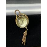 A Brass and glass desk ball clock. [5cm in length]