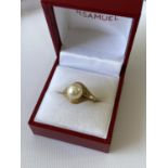 A ladies 14k gold ring set with a single pearl setting, stamped [K14], [3.60g] [size L]