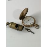 A Vintage American Waltham U.S.A travel pocket watch & railway style brass whistle.