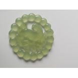 A Chinese pale jade sculpture pendant [6cm in diameter] [32.09grams]