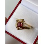 An 18ct gold ladies diamond & ruby set ring [size M] [4.13g]
