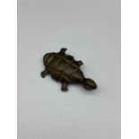 An Antique Chinese bronze made turtle pendant with hidden snuff compartment. [4.7cm in length]
