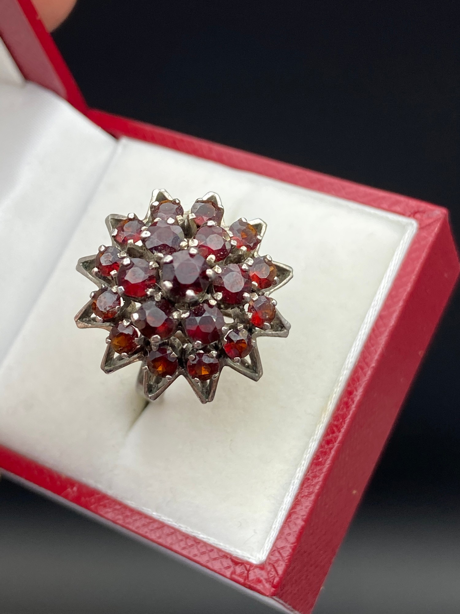 A Ladies silver and garnet cluster ring. [Ring size M] - Image 3 of 4