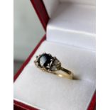 An 18ct gold ladies sapphire & diamond set ring [diameter 6mm] [size M] [2.89g]