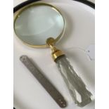 A large Brass cased magnifying glass. [22cm in length]