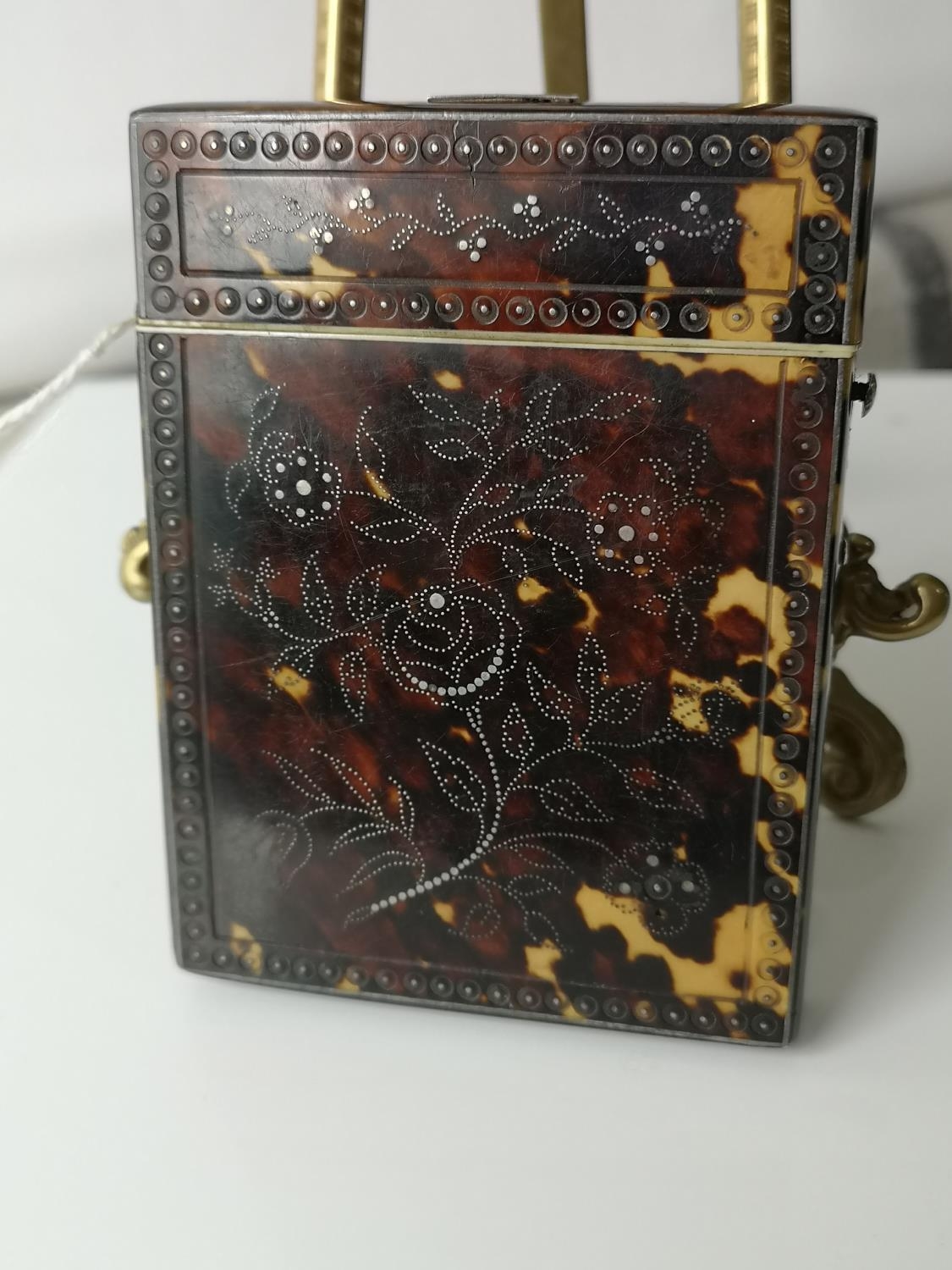 A nice example of a 19th century turtle shell card case detailed with silver pin floral design