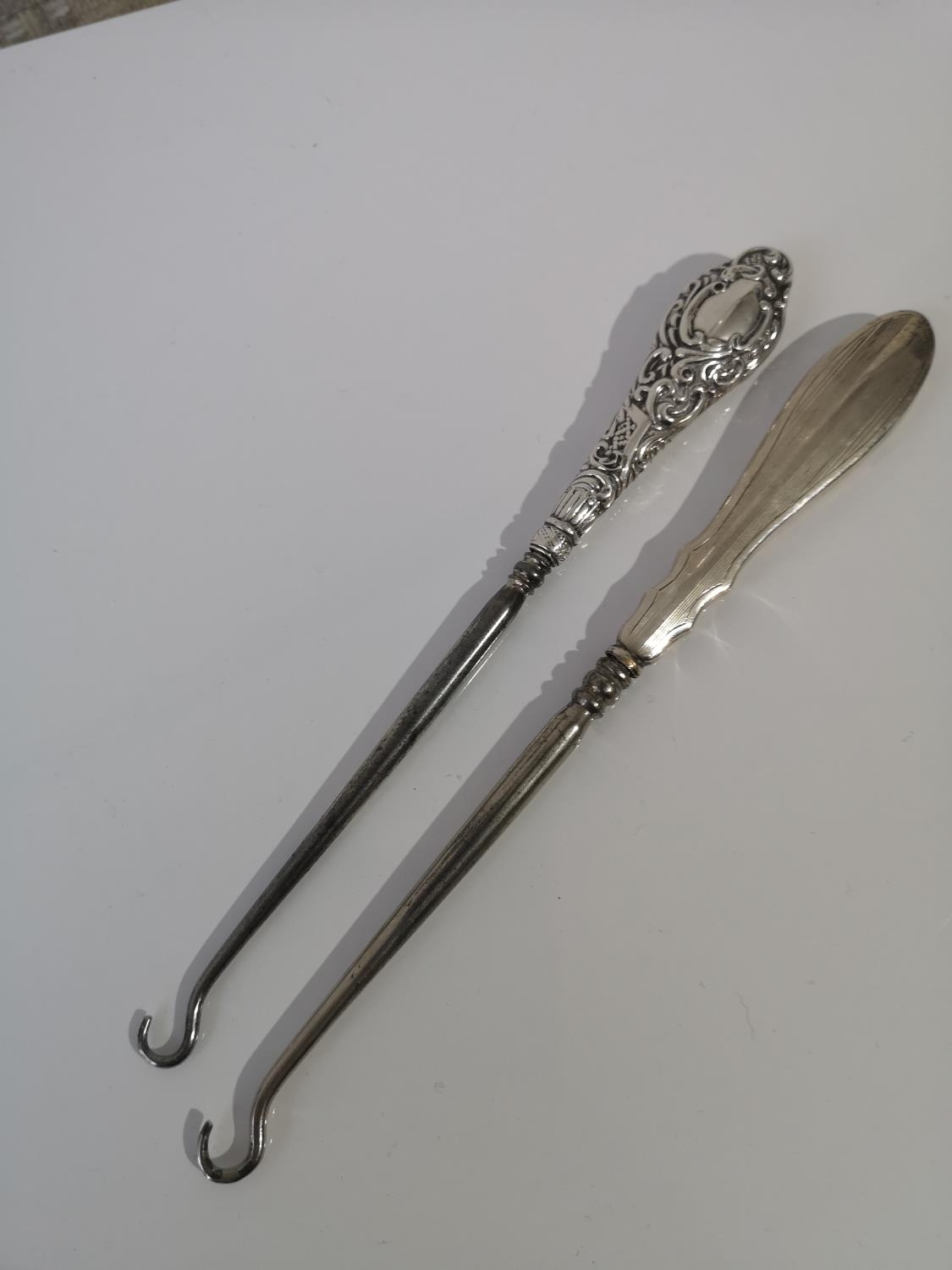 TWO BIRMINGHAM SILVER HANDLE BUTTON HOOKS. BIRMINGHAM 1903 HENRY CHARLES FREEMAN & WILLIAM NEALE AND