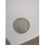A SILVER 1879 ONE DOLLAR COIN.