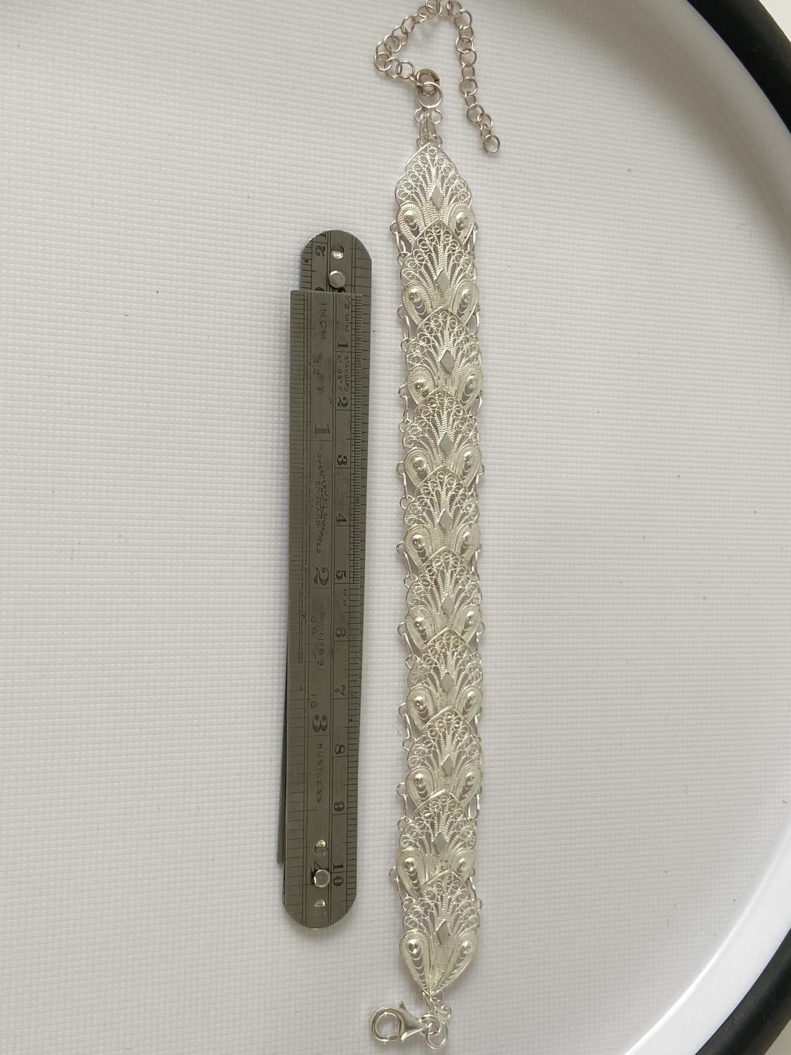 A Silver filigree bracelet [20cm in length] - Image 2 of 2