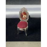 A Silver chair pincushion with enamel plaque [4.5cm in height]