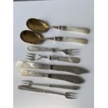 A selection of mother of pearl handled flat wares to include; Chester silver pickle forks [Adie &