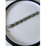 A silver filigree & turquoise stone bracelet [length 18cm]