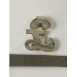 A Silver money clip in the form of a pound sign. [13.5cm in length]