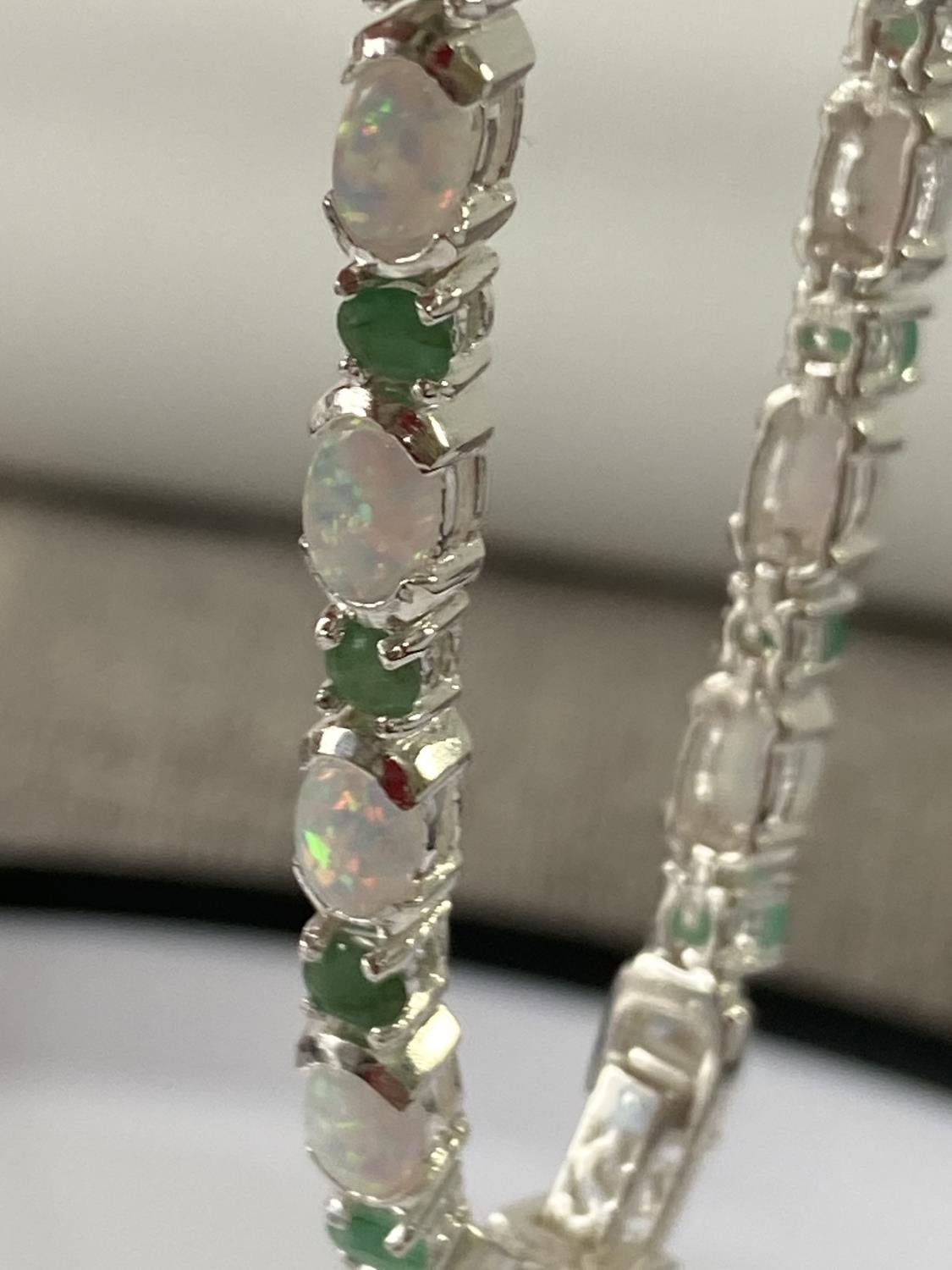 A Silver opal and emerald line bracelet [18.5cm in length] - Image 8 of 8