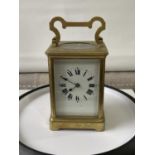 Antique heavy brass carriage clock [makers name unreadable] in a working order with double drum