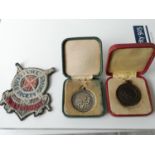 A Vintage Royal Life Saving Society patch & two medals. one of which is Birmingham silver & the