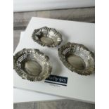 Three various antique silver pierced pin dishes. [2.5x12.5x9.5cm] [97.77grams]