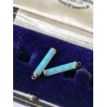 A Pair of 9ct gold [tested] and opal cylinder charms/ earrings [1.5cm in length] [0.48grams]