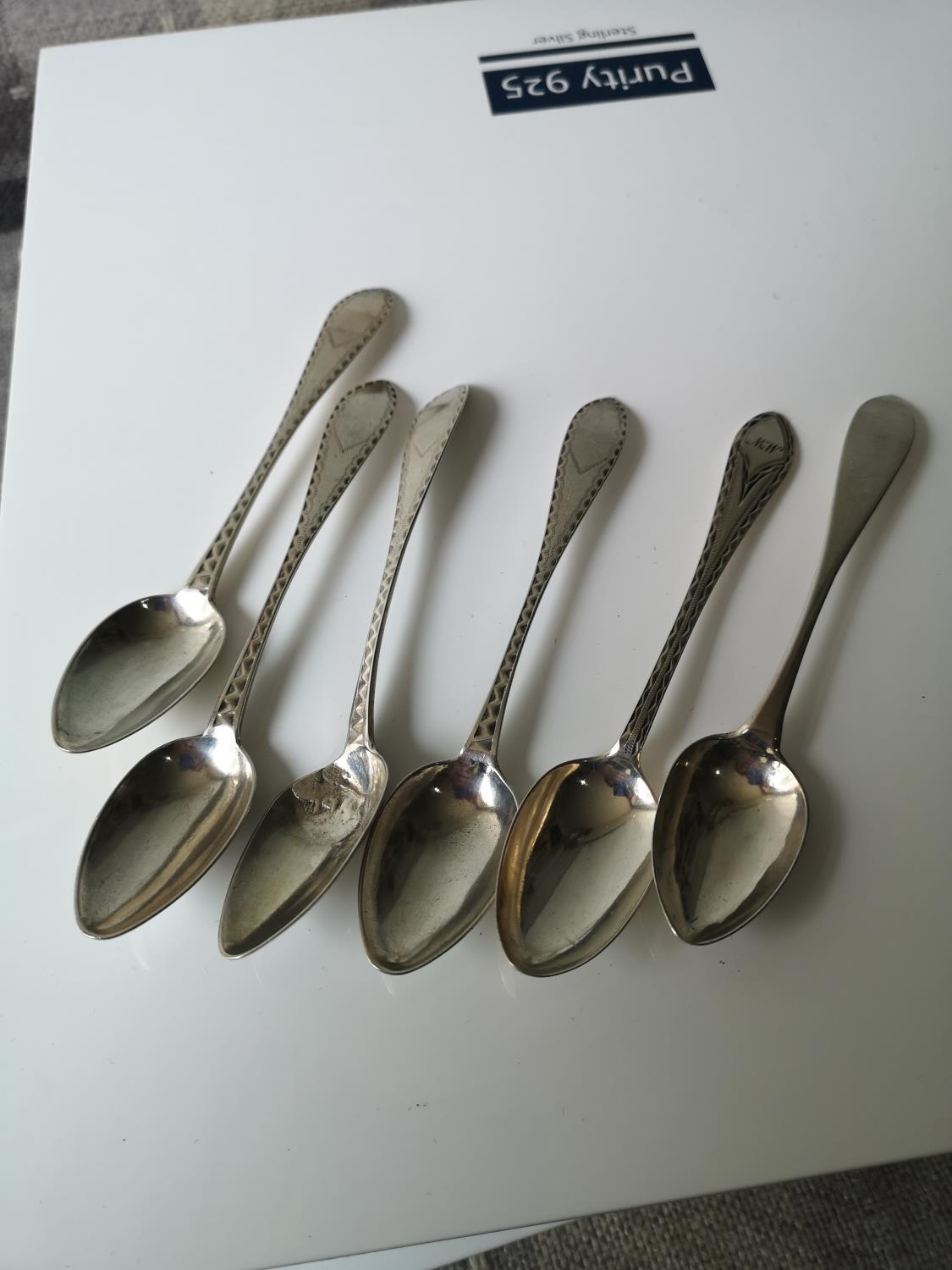 A Set of four provincial Scottish silver tea spoons with two other provincial tea spoons. Four