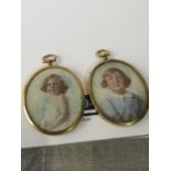 TWO ANTIQUE MINIATURE PORTRAITS OF YOUNG CHILDREN. FITTED WITH OVAL GILT BRASS FRAMES. [9X7CM]